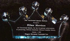 Crown-shaped glass award for Wilma Morrison.