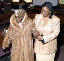 Mary Crosby Chappelle is escorted by her granddaughter.