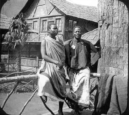 Two men standing.