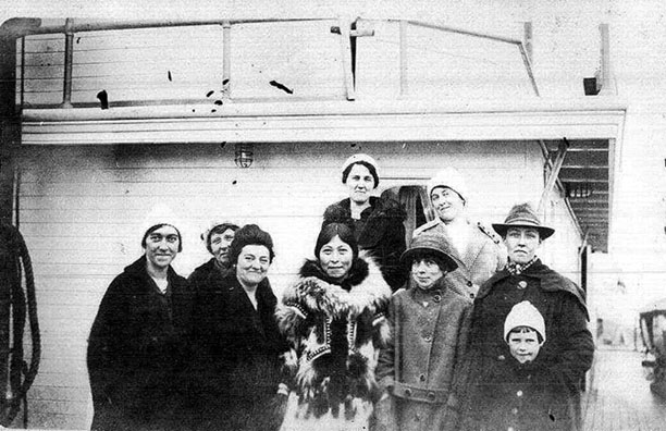 Unaquthlook (center) on the ship headed to the Pan Am Exposition.