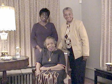 Photo of three women inside a home.
