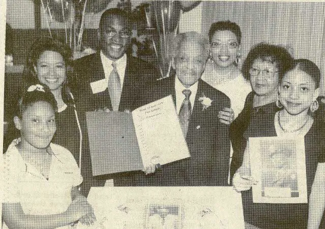 Mr. Price and his family are joined by Mayor Brown as he celebrates his 100th birthday.