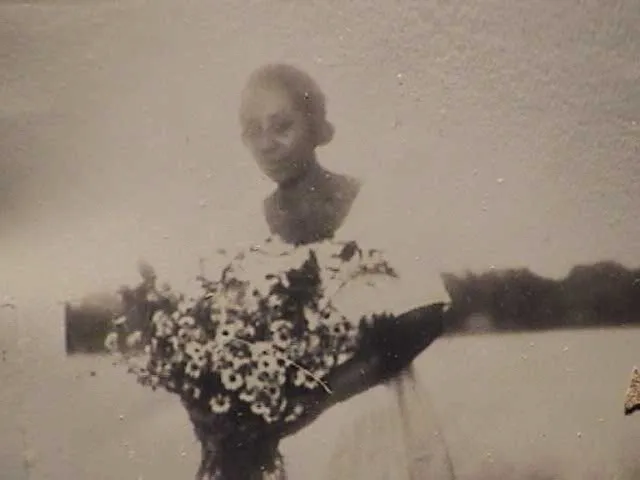 Mrs. Nash with flowers.  Date unknown